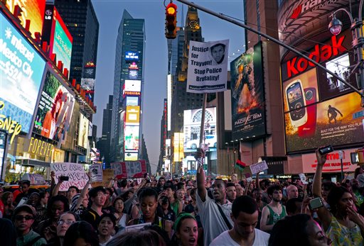 Marchers congregate in Times Square, protesting George Zimmerman’s acquittal in the killing of 17-year-old Trayvon Martin. Mostly peaceful demonstrations occurred across the nation. (Photo by Craig Ruttle/AP)