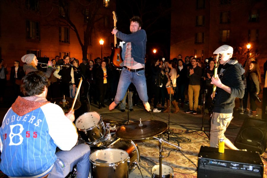 The band Wooderson gives a rousing performance to a large crowd outside of Rodrigues coffee house. COURTESY OF DAYNE CARTER