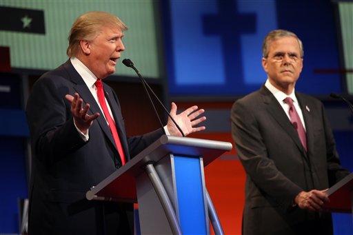 Republican presidential candidates Donald Trump and Jeb Bush met at a debate last Wednesday. Andrew Harnik/AP