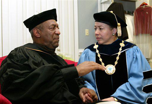 FILE - In this May 14, 2006 file photo, keynote speaker Bill Cosby, left, and Spelman College President Dr. Beverly Tatum talk before the start of commencement at the school in Atlanta. Cosbys legacy of giving is decades-old and extensive, topped by a $20 million gift to Spelman College in 1988 and including, among many other donations, $3 million to the Morehouse School of Medicine; $1 million in 2004 to the U.S. National Slavery Museum in Fredericksburg, Virginia; and $2 million from Cosbys wife, Camille, to St. Frances Academy in Baltimore in 2005. (AP Photo/W.A. Harewood, File)