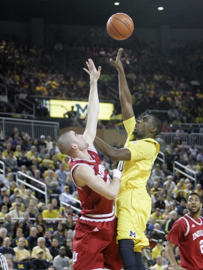 Michigans Tim Hardaway Jr. shoots against Indianas Will Sheeehey, left, during first-half action at the Crisler Center in Ann Arbor, Michigan, on Wednesday, February 1, 2012. (Kirthmon F. Dozier/Detroit Free Press/MCT)