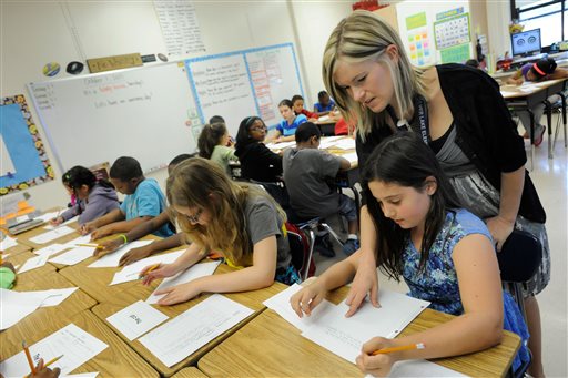 Many Muslim families must choose to keep kids home on holidays or miss class. Steve Ruark/AP