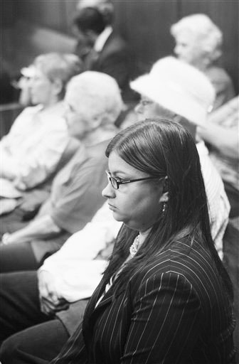 Stephanie Toti of New York, an attorney for the Center for Reproductive Rights, waits for a hearing to begin in a courtroom packed with more than a dozen abortion rights supporters clad in pink in Oklahoma  City Friday, Jan. 21, 2011. Oklahoma County judge Noma Gurich ruled that an anti-abortion group will be permitted to intervene in a lawsuit that challenges a state law requiring women seeking abortions to have an ultrasound examination and listen to a detailed description of the fetus. (AP Photo/Sue Ogrocki)