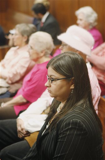 Stephanie Toti of New York, an attorney for the Center for Reproductive Rights, waits for a hearing to begin in a courtroom packed with more than a dozen abortion rights supporters clad in pink in Oklahoma  City Friday, Jan. 21, 2011. Oklahoma County judge Noma Gurich ruled that an anti-abortion group will be permitted to intervene in a lawsuit that challenges a state law requiring women seeking abortions to have an ultrasound examination and listen to a detailed description of the fetus. (AP Photo/Sue Ogrocki)