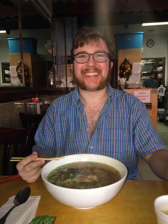 Patrick Hood smiles for the camera while enjoying his pho. (Courtesy of Caitlyn Letterii)