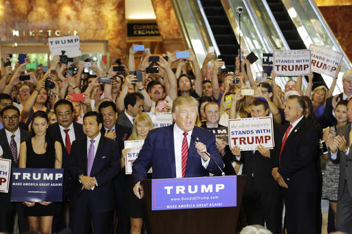 FILE - In this Sept. 3, 2015 file photo, Republican presidential candidate Donald Trump holds a news conference in the lobby of Trump Tower in New York. Days before New Yorks presidential primaries, the 58-story tower in midtown Manhattan is a cross-section of the world, alive with chatter about the Republican front-runner. People mill around the massive marble entrance floors, sprinkled with boutiques and eateries all bearing his gold-lettered name. (AP Photo/Mark Lennihan, File)
