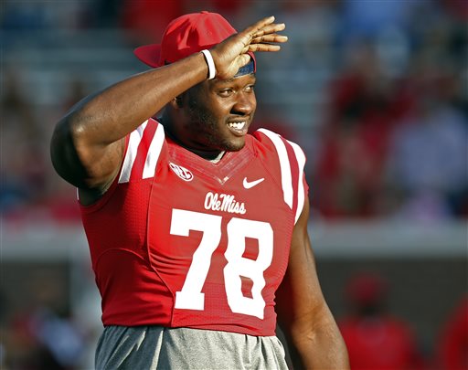Photographs of offensive tackle Laremy Tunsil smoking marijuana surfaced just before the NFL draft, hurting his stock. (Rogelio V. Solis/AP)