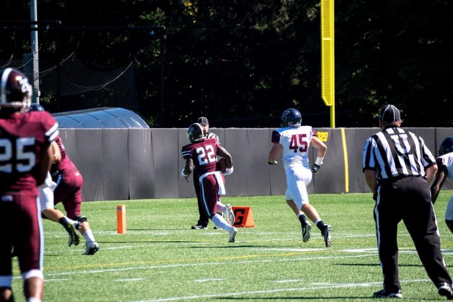 Chase Edmonds heads to the end zone for one of his four touchdowns against UPenn. (Andrea Garcia/The Fordham Ram)