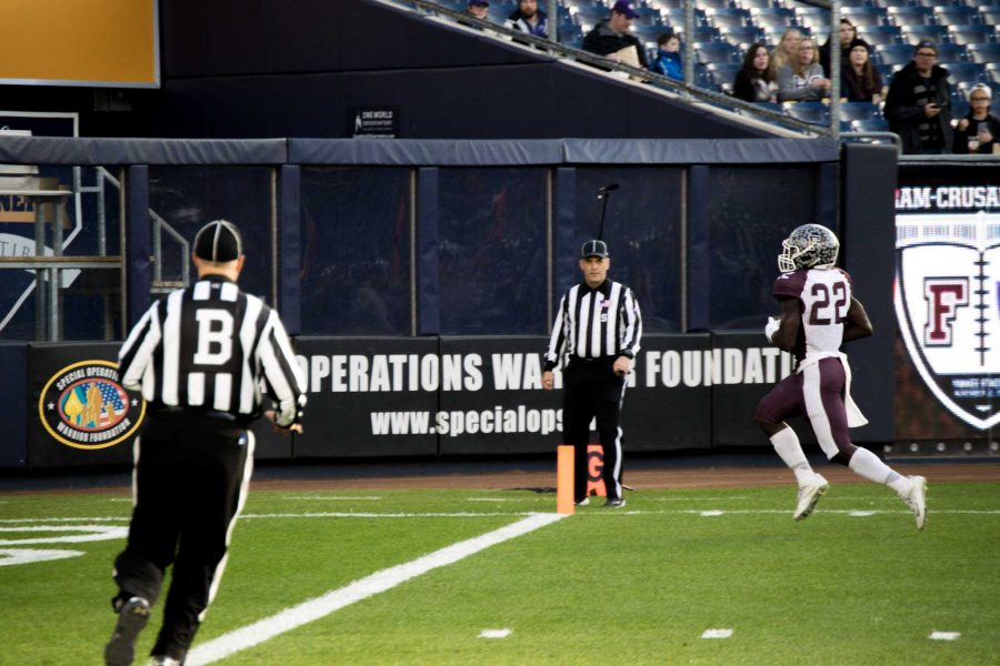 Chase Edmonds heads to the end zone for the first of his four touchdowns at Yankee Stadium on Saturday. (Andrea Garcia/The Fordham Ram). 
