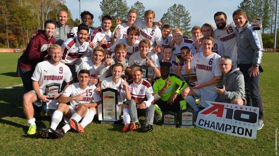 The men’s soccer team poses after winning their second A-10 Championship in three years, and third all-time. (Courtesy of Fordham Athletics). 