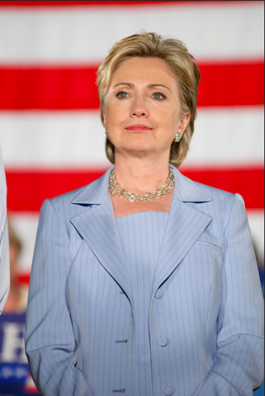 Never underestimate the power of a pantsuit and a killer countenance. 