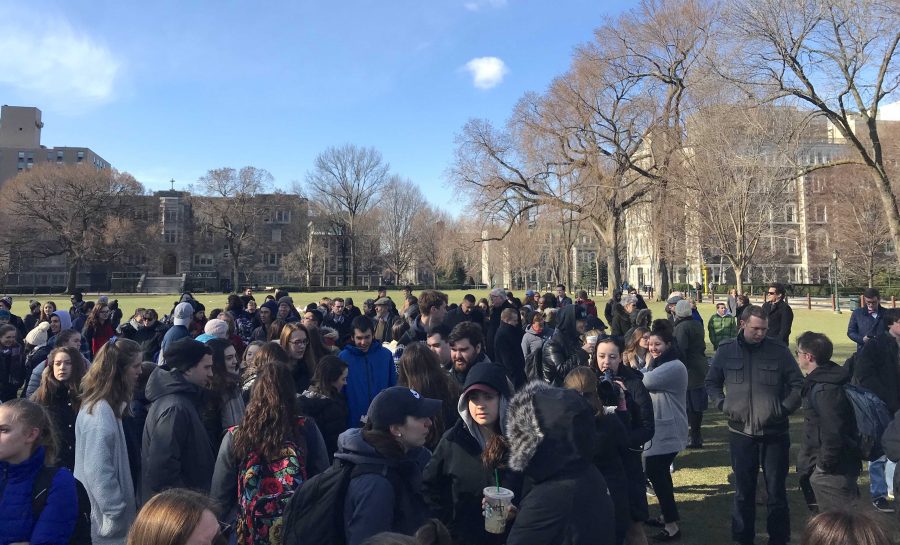 Students and faculty stood in silence for 17 minutes on Wednesday (Kevin Stoltenborg/The Fordham Ram). 