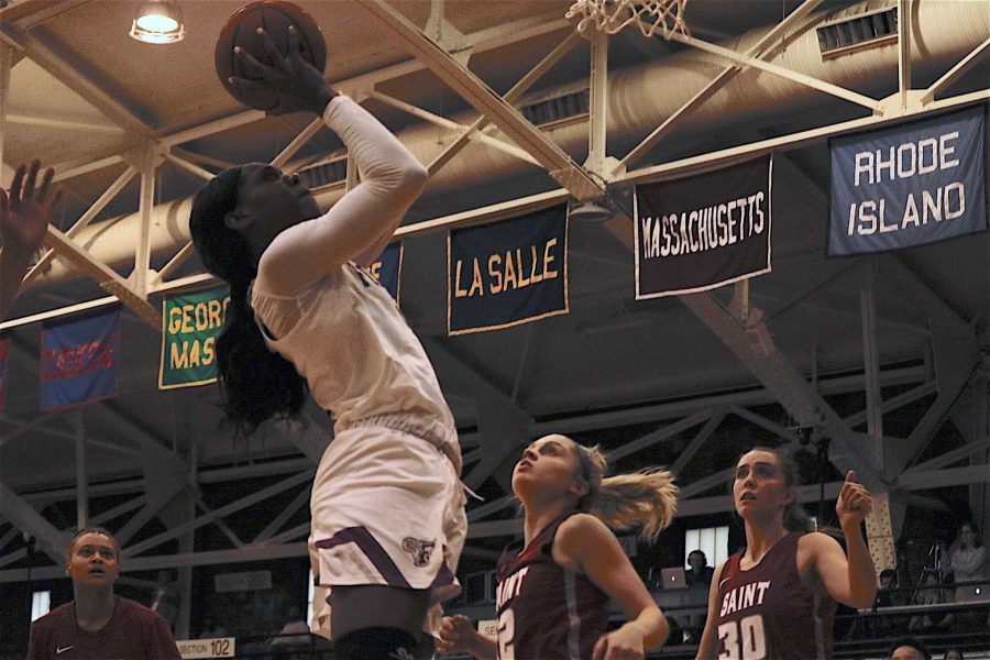 G’mrice Davis (above) rises for a layup.  The Rams’ season ended on Friday with a loss to St. Joseph’s. (Julia Comerford/The Fordham Ram)