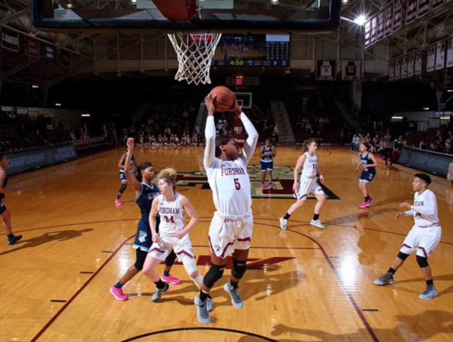 Gmrice Davis pulls down one of her game-high 16 rebounds. (Courtesy of Fordham Athletics)