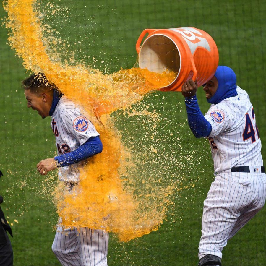 Wilmer Flores gets doused with Gatorade following his walkoff homer on Sunday. (
Courtesy of Twitter)