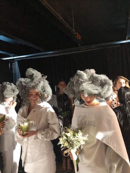 Models prepare for the runway backstage at Brooklyns Navy Yard. (Isiah Magsino/The Fordham Ram)