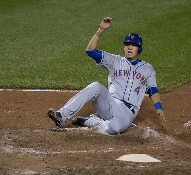 Wilmer Flores slides into home. The beloved Met said goodbye on Friday. (Keith Allison/Flickr)