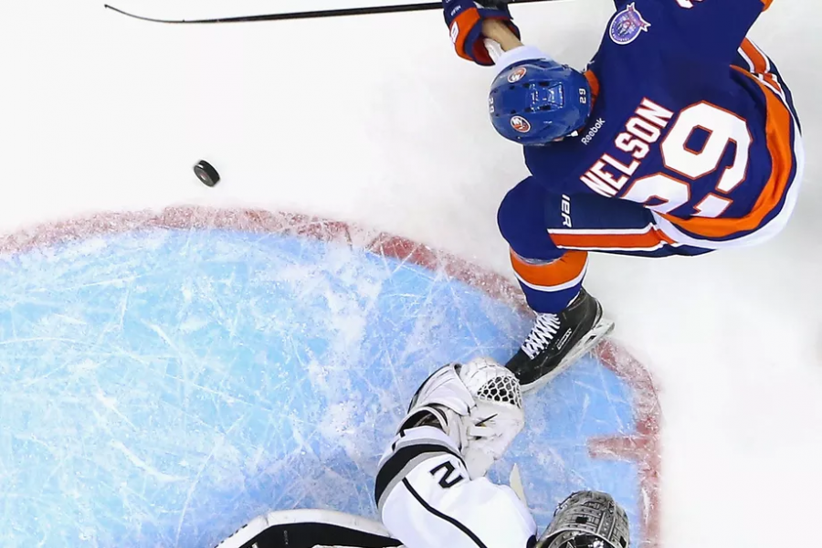 Brock Nelson in a tight battle in the crease with Kings goaltender Jonathan Quick. (Bruce Bennett/Getty Images)
