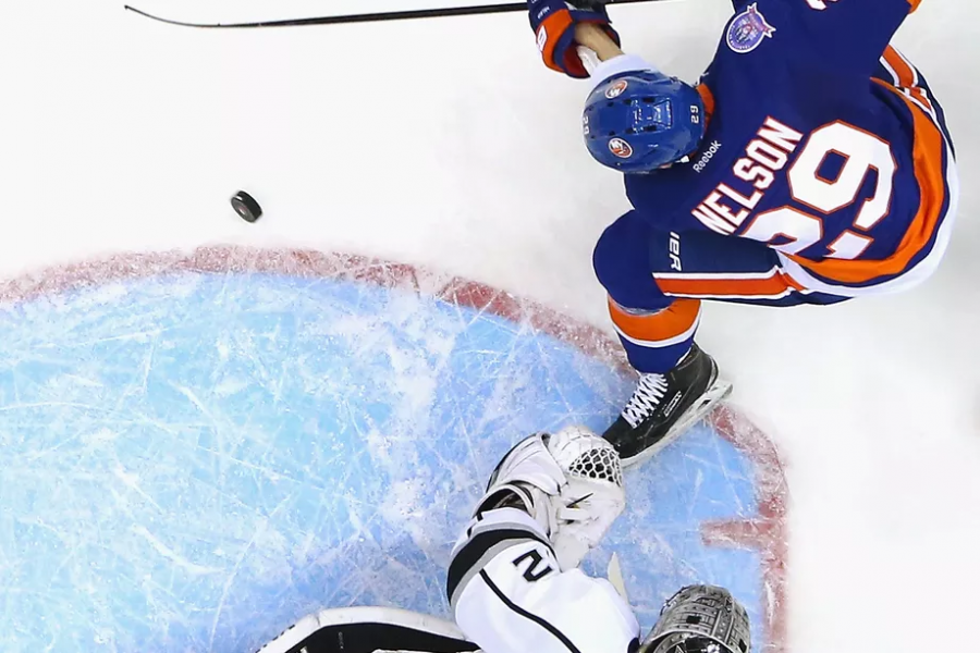 Brock Nelson in a tight battle in the crease with King's goaltender Jonathan Quick. (Bruce Bennett/Getty Images)