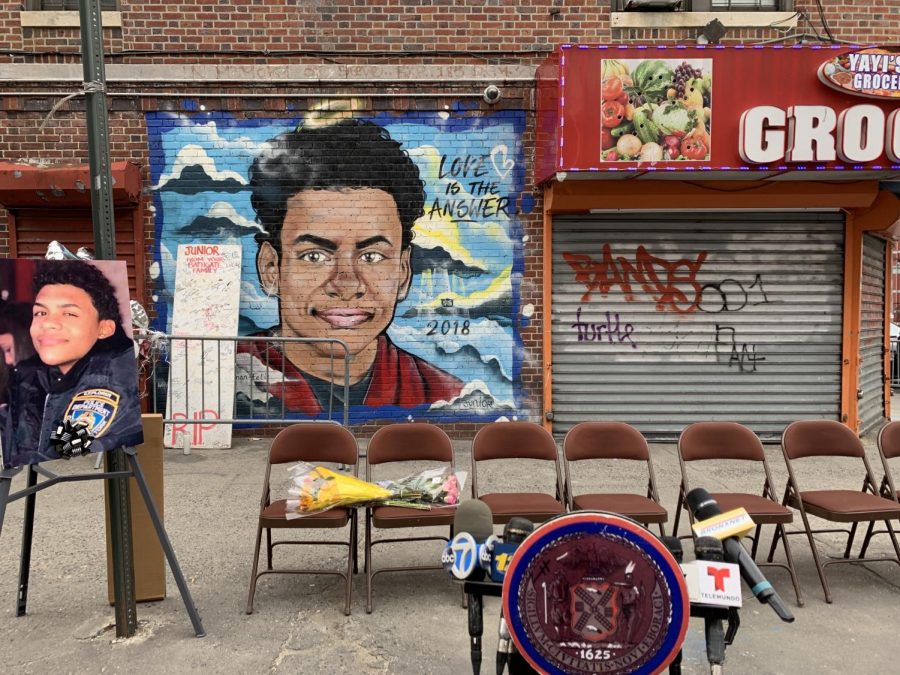 A mural with the words "Love is the answer" painted on the Bodega where Guzman-Feliz was killed served as the backdrop for the street co-naming. (Eliot Schiaparelli/The Fordham Ram) 