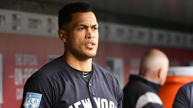 Mar+25%2C+2019%3B+Washington%2C+DC%2C+USA%3B+New+York+Yankees+left+fielder+Giancarlo+Stanton+%2827%29+looks+on+from+the+dugout+against+the+Washington+Nationals+before+the+game+at+Nationals+Park.+Mandatory+Credit%3A+Brad+Mills-USA+TODAY+Sports