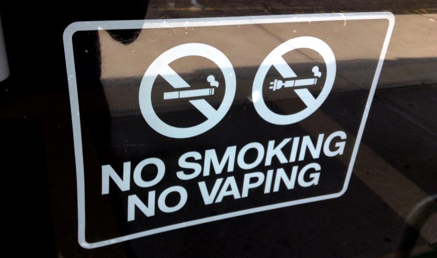 Signs attempt to discourage people from smoking or vaping. (Courtesy of Flickr)