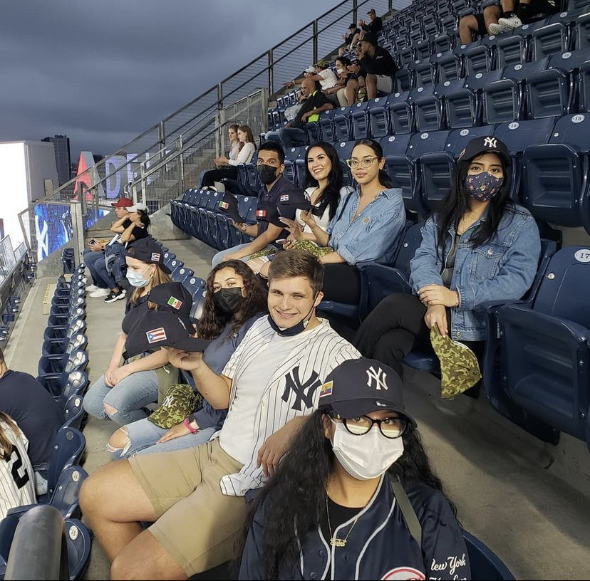 Fordham students enjoy a night at Yankee Stadium as part of Fordham Office of Multicultural Affairs’ Latinx Heritage Committee’s group celebration of the month.
