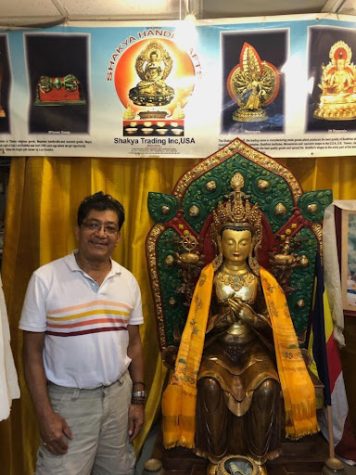 Sagar Shakya and the Maitreya Buddha. (courtesy of Ryan Heffron for the Fordham Ram)