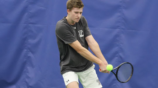 Tom Russwurm battles at Queens College last weekend. (Courtesy of Fordham Athletics)