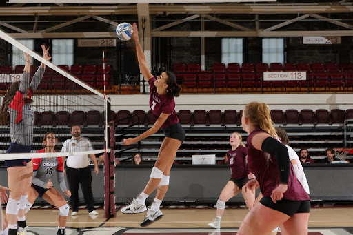 Senior Aria De La Rosa times up the kill vs. Dayton on Saturday. (Courtesy of Fordham Athletics)