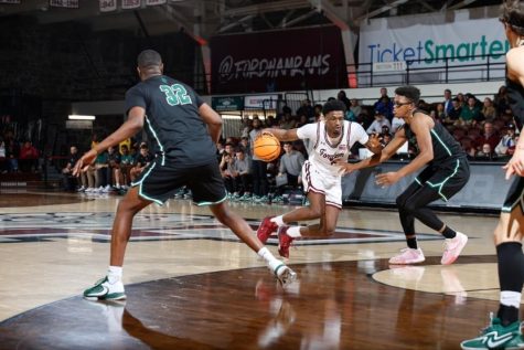 Graduate Student Khalid Moore goes for two of his 18 points, a stellar debut for Fordham. (Courtesy of Fordham Athletics)
