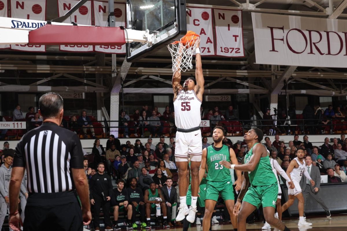 Antrell+Charlton+is+helped+up+by+his+teammates+during+Fordham%E2%80%99s+win+over+Manhattan+College+on+Monday+night.+%28Courtesy+of+Twitter%29