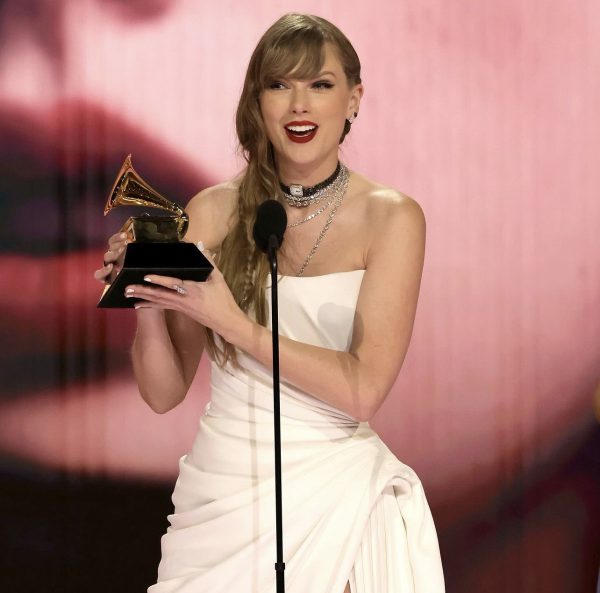 Taylor Swift lifted a fourth Album of The Year award at the Grammys. (Courtesy of Instagram)
