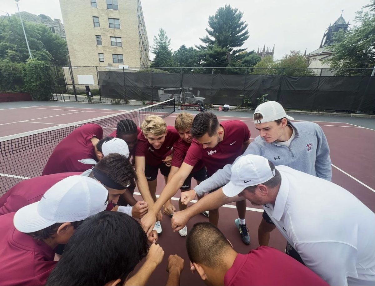 Fordham Men's Tennis huddles before its hidden dual against FDU. (Courtesy of Instagram/@fordhammenstennis)