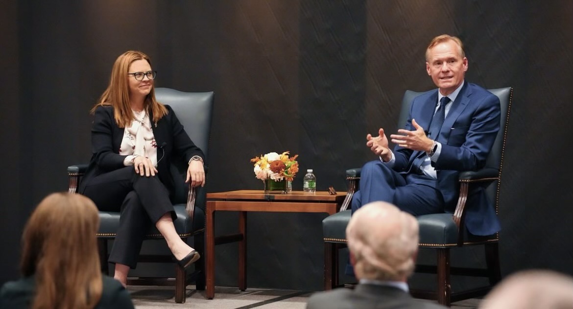 President Tania Tetlow speaks with CBS News anchor John Dickerson at a FitzSimons Initiative event. (Courtesy of Instagram)