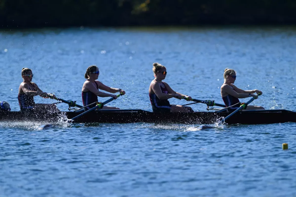 A Fordham boat races across the waters of the Schuylkill River. (Courtesy of Fordham Athletics)