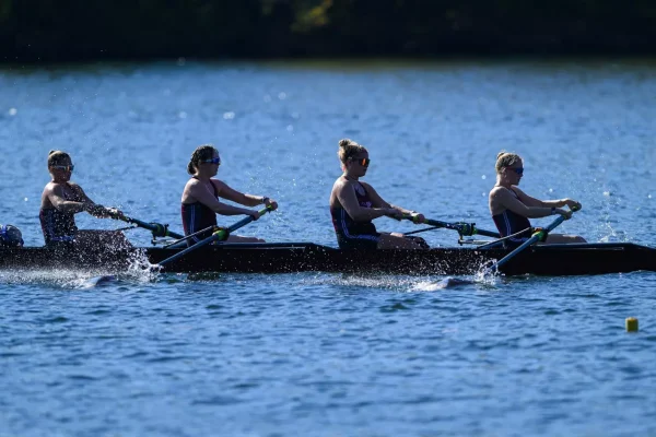 A Fordham boat races across the waters of the Schuylkill River. (Courtesy of Fordham Athletics)