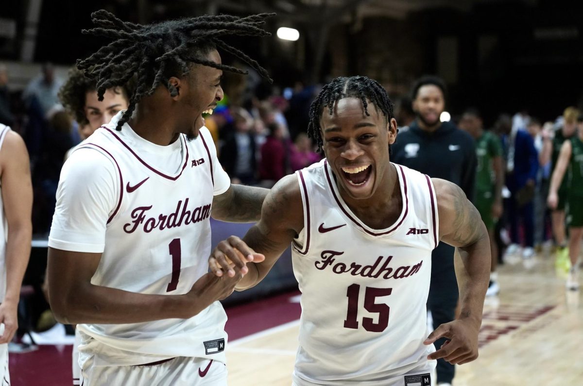 Will Richardson and Jackie Johnson III rejoice during a home-opening victory against Binghamton. (Courtesy of Diego Martinez Reyes for The Fordham Ram)