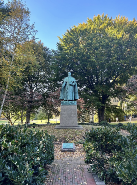 A large statue of Archbishop John Hughes stands prominently facing Cunniffe House on Fordham’s Rose Hill campus. (Courtesy of Allison Schneider/The Fordham Ram)