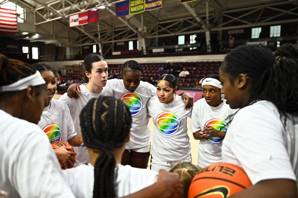 The Fordham women’s basketball team huddle up before a home matchup (Courtesy of Fordham Athletics).