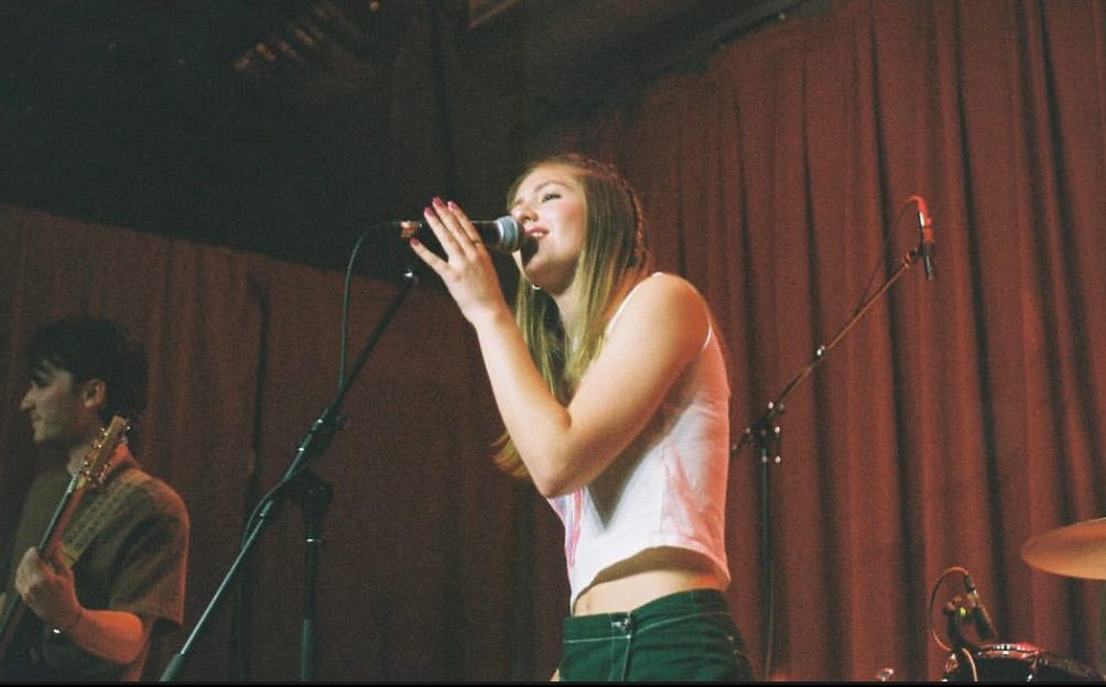 Fordham student Christina Priestner, FCRH ‘26, performs live with The Wave on Jan. 25 at The Bronx Beer Hall. (Christina Priestner for The Fordham Ram)