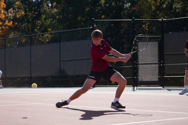 Will Lokier, a Fordham University freshman on the Men's Tennis Team, competes in a match.