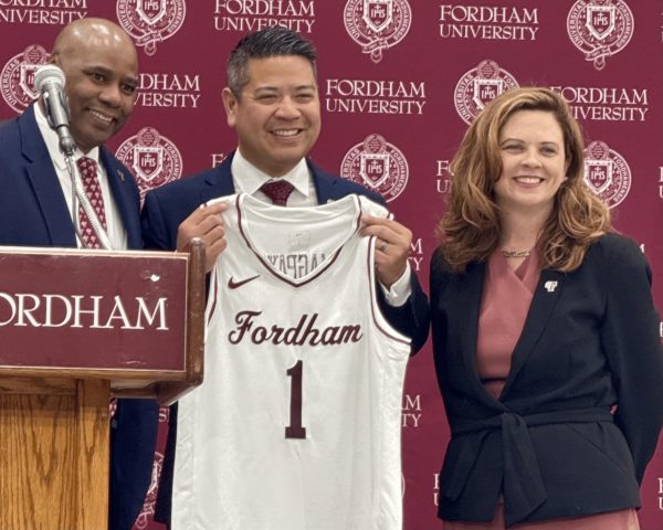 Coach Mike Magpayo stands with Athletic Director Charles Guthrie and President Tetlow at his inaugural press conference. (Ian Nelson/The Fordham Ram)