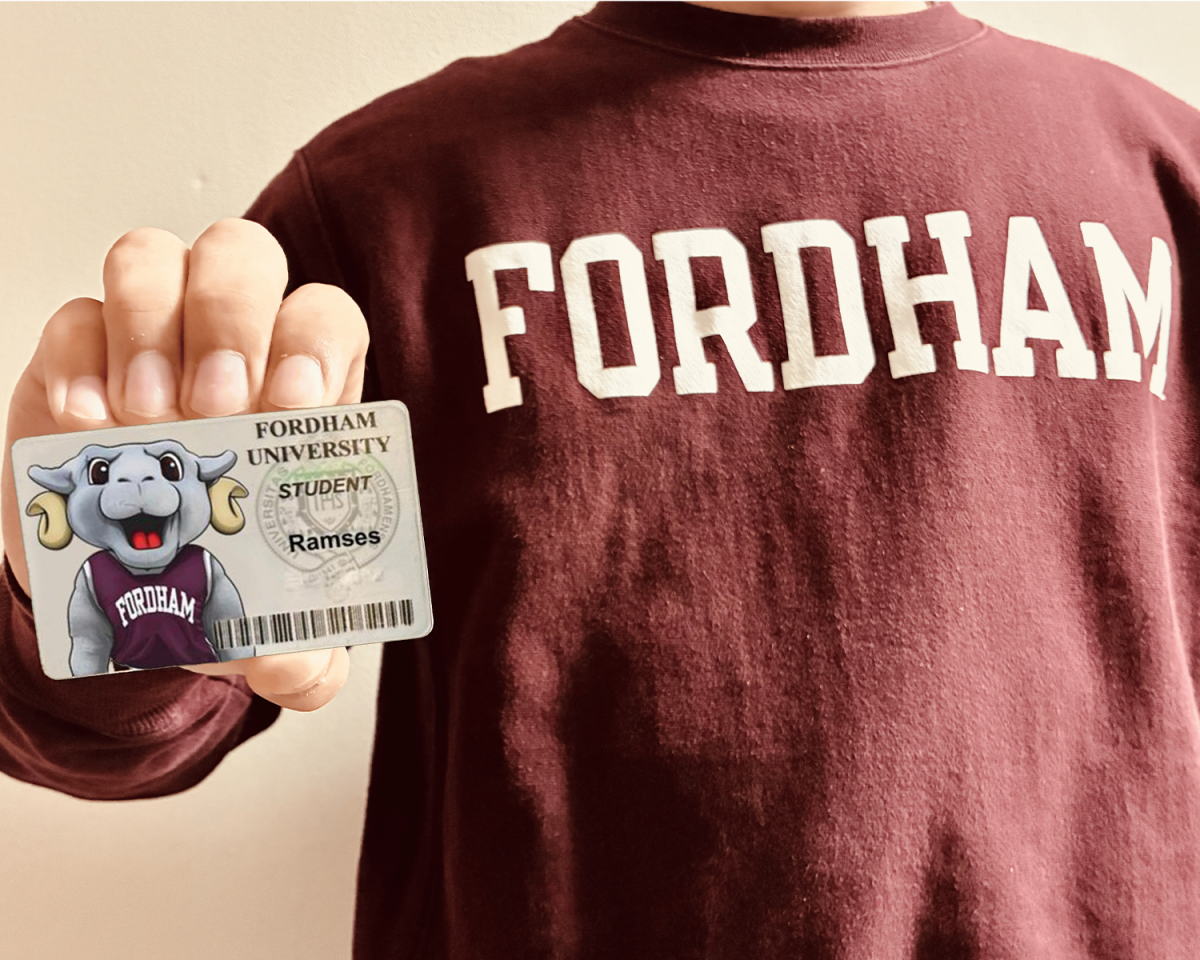 A student holding a Physical ID with Ramses on it. (Andrew Massie/The Fordham Ram)