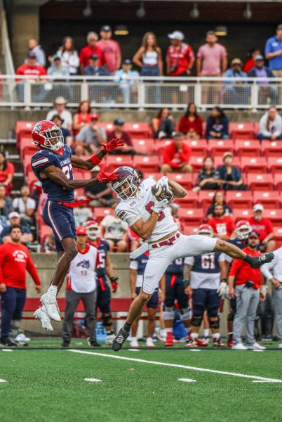 A Fordham receiver makes a contested catch.