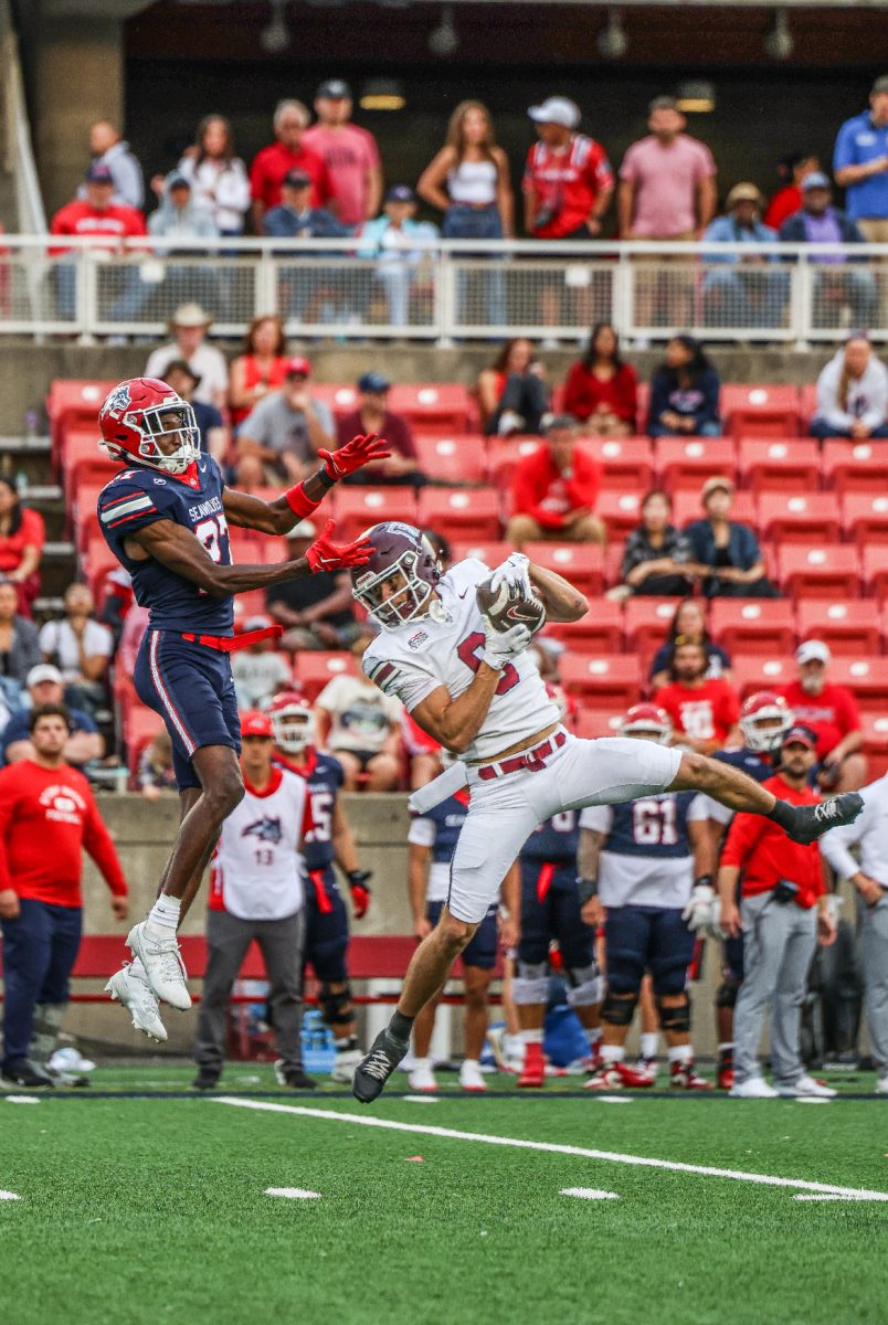 A Fordham receiver makes a contested catch.