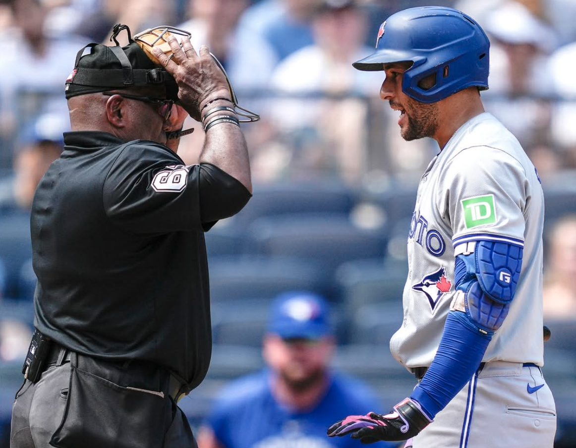 Blue Jays centerfielder George Springer argues with an umpire over balls and strikes.