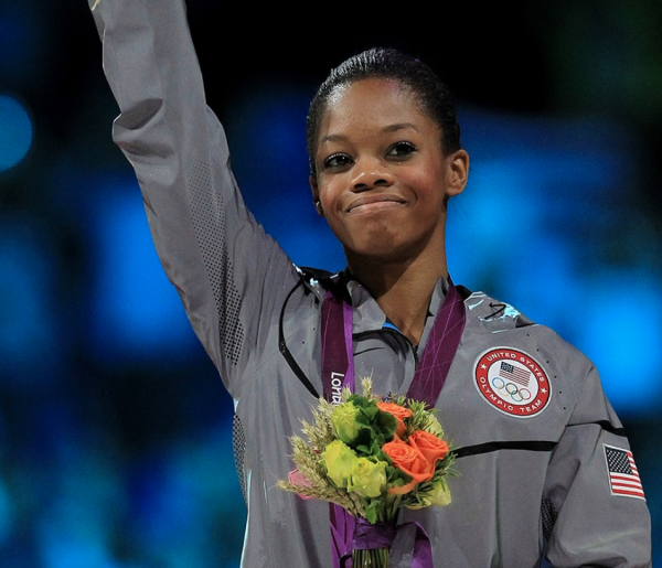 Gabby Douglas holds a bouquet of flowers (Courtesy of Instagram @usagym for The Fordham Ram)