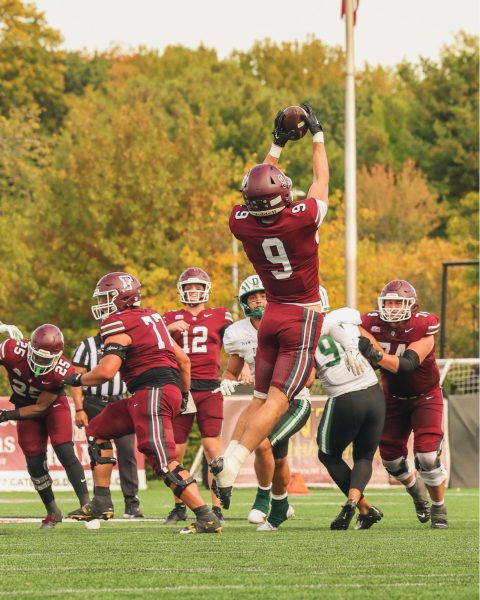 Fordham wide receiver Jack Freeburg hauls in a pass from quarterback Gunnar Smith.