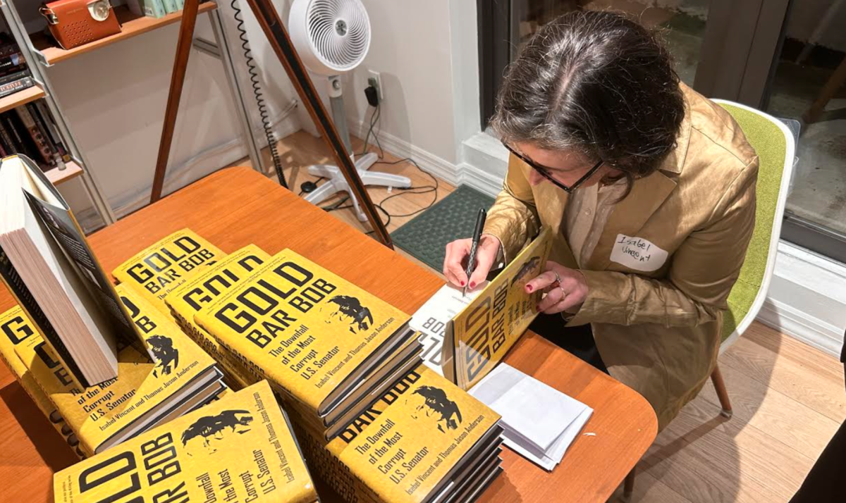 Professor Isabel Vincent signs copies of her newly published book "Gold Bar Bob: The Downfall of the Most Corrupt U.S. Senator." (Sidney Blasco/The Fordham Ram)